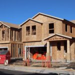 Wooden frames of new houses under construction in Elk Grove subdivision.
