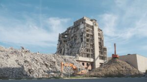 Urban demolition scene with a digger at a construction site in Volgograd.